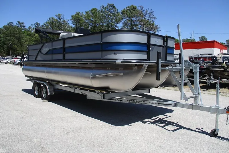 Slide: The Image of 2026 Bentley Pontoons Fish 243 4-Point on trailer, parked outdoors. - 5