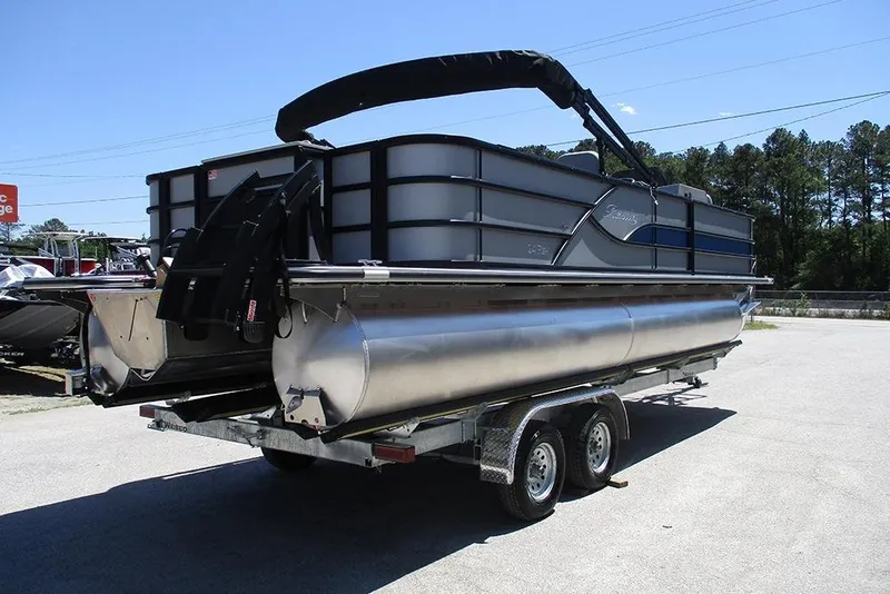 Slide: The Image of 2026 Bentley Pontoons Fish 243 4-Point on trailer, parked outdoors, side view. - 7