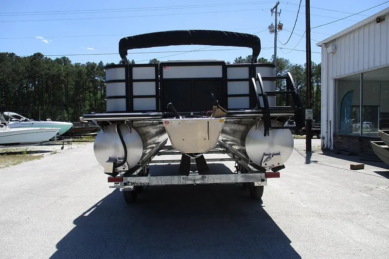 Slide: The Image of 2026 Bentley Pontoons Fish 243 4-Point on trailer, rear view in outdoor setting. - 8
