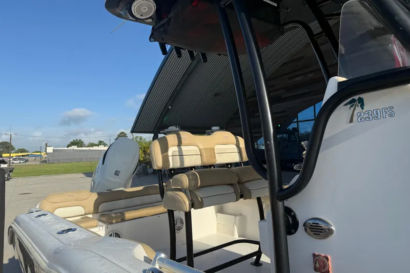 Slide: The Image of 2016 Key West 239 FS boat interior with seating and console details. - 18