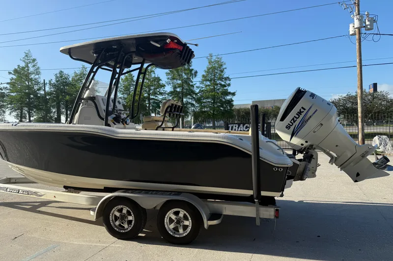 Slide: The Image of 2016 Key West 239 FS boat on trailer with Suzuki outboard motor. - 7