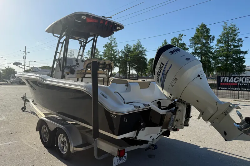 Slide: The Image of 2016 Key West 239 FS boat with Suzuki 300 engine on trailer. - 8