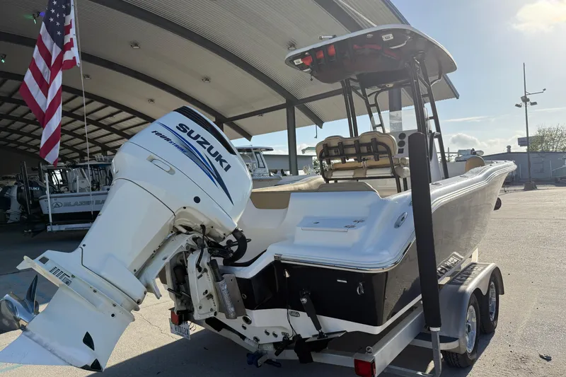 Slide: The Image of 2016 Key West 239 FS boat with Suzuki outboard motor on trailer. - 9