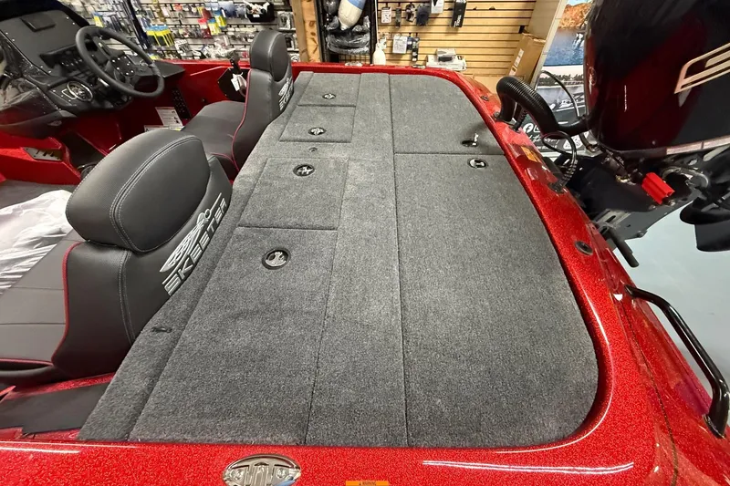 Slide: The Image of 2026 Skeeter ZX150 boat interior with cushioned seats and storage compartments. - 13
