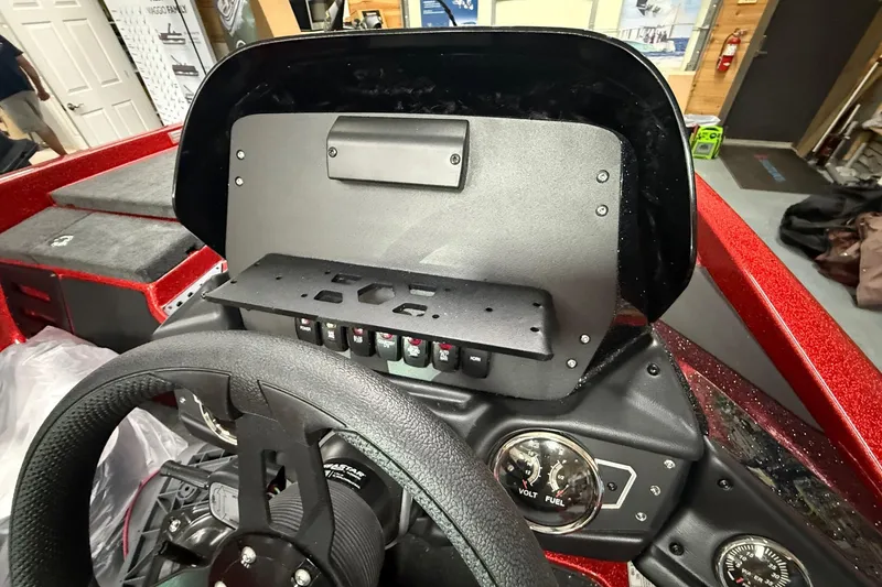 Slide: The Image of 2026 Skeeter ZX150 boat dashboard with steering wheel and control panel. - 17