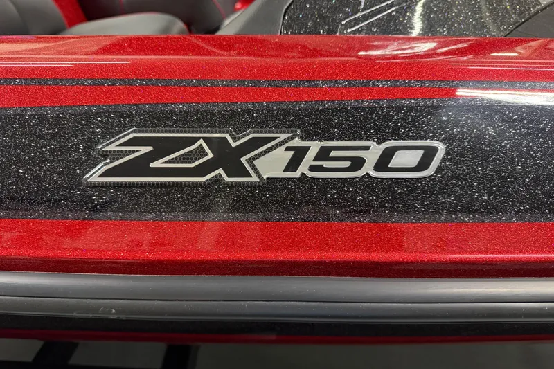 Slide: The Image of 2026 Skeeter ZX150 boat logo on a sparkling red and black surface. - 2