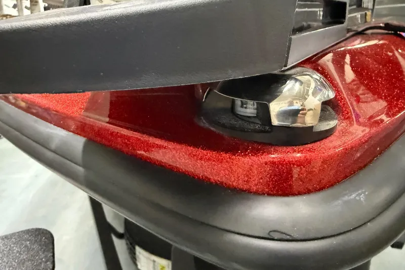 Slide: The Image of Close-up of 2026 Skeeter ZX150 boat with metallic red finish and chrome details. - 9