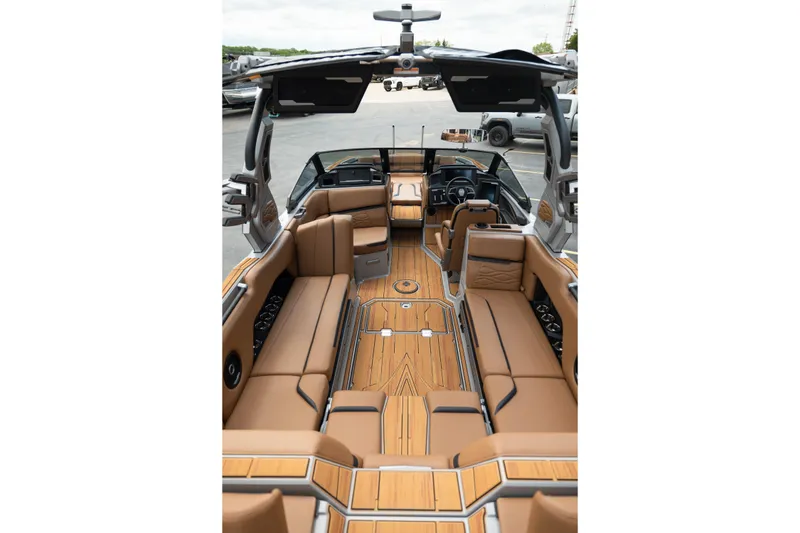 Slide: The Image of Luxurious interior of 2025 Supra SE 550 boat with tan seating and sleek design. - 14