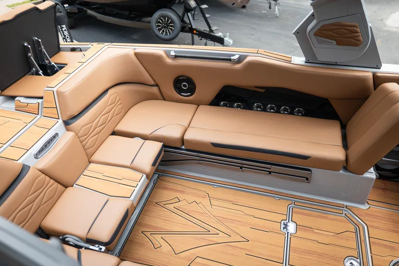 Slide: The Image of Luxurious interior of 2025 Supra SE 550 boat with tan leather seating and wood accents. - 17