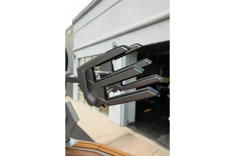 Slide: The Image of Robotic arm detail on 2025 Supra SE 550, outside a modern building. - 19