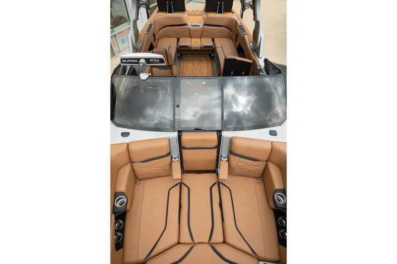 Slide: The Image of Luxurious interior of 2025 Supra SE 550 boat with tan leather seating. - 31