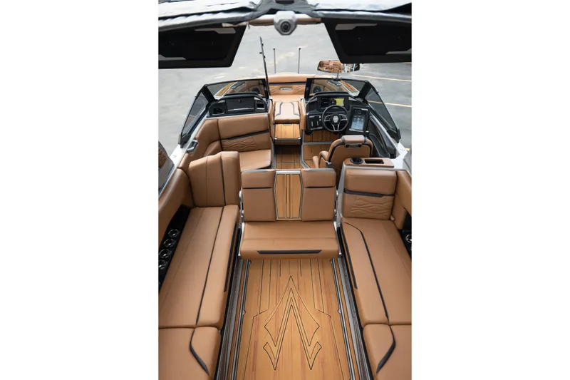 Slide: The Image of Luxurious interior of 2025 Supra SE 550 boat with tan leather seating and modern dashboard. - 35
