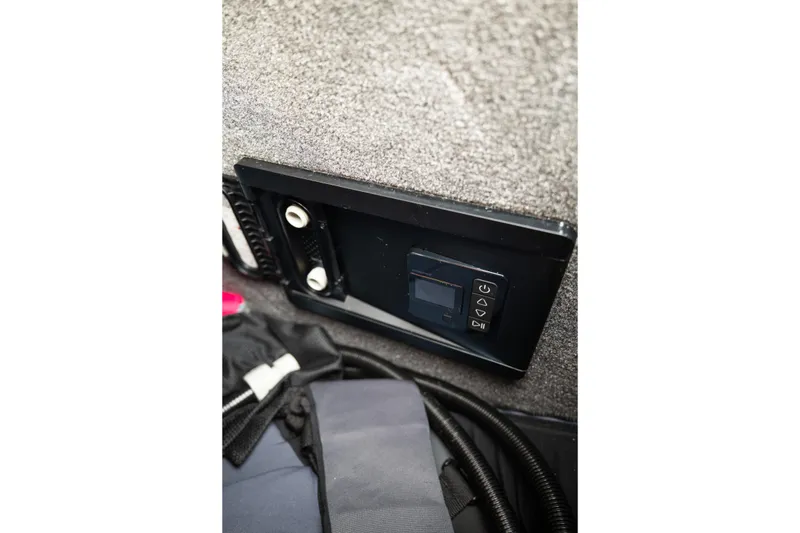 Slide: The Image of Control panel in 2025 Supra SE 550 boat interior, featuring digital display and buttons. - 42