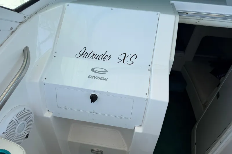 Slide: The Image of 2004 Envision 3200 Intruder XS boat interior with branding and speaker detail. - 11