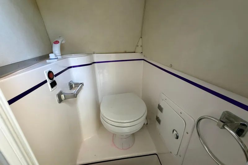 Slide: The Image of Compact bathroom in 2004 Envision 3200 Intruder boat with toilet and fixtures. - 18