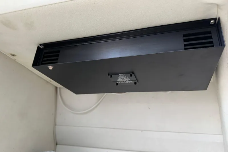 Slide: The Image of Black audio amplifier installed in a 2004 Envision 3200 Intruder boat interior. - 21