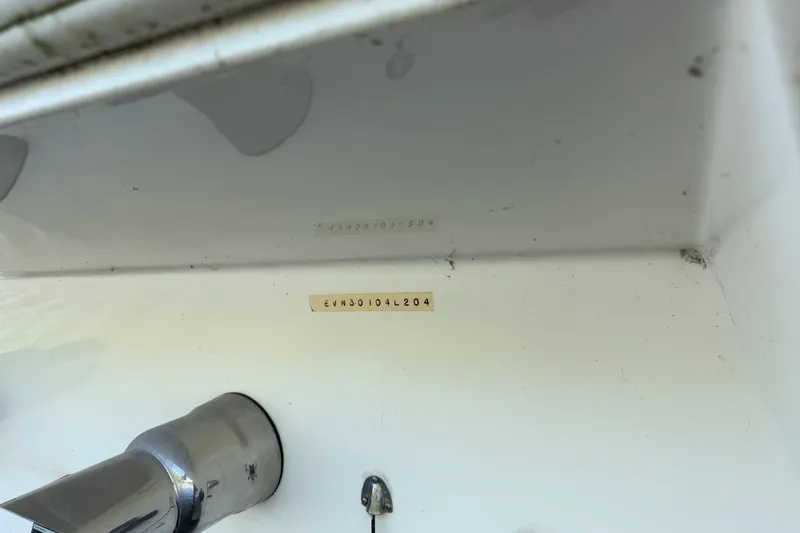 Slide: The Image of Close-up of a 2004 Envision 3200 Intruder boat hull identification number. - 31
