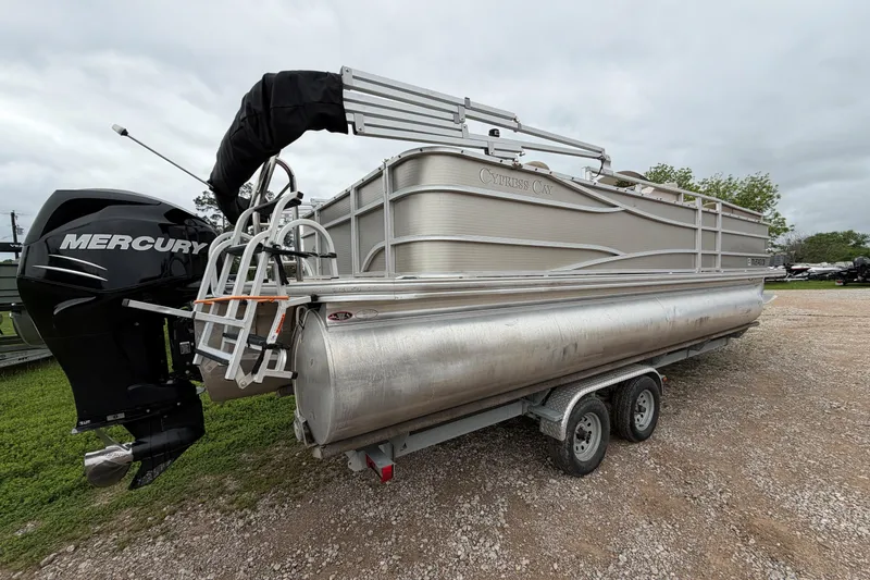 Slide: The Image of 2013 Cypress Cay Cabana 240 pontoon boat with Mercury engine on a trailer. - 2