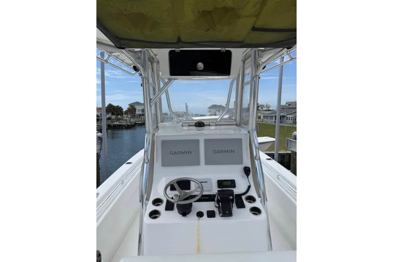Slide: The Image of 2024 Contender 28 Tournament boat helm with dual Garmin displays and controls. - 4