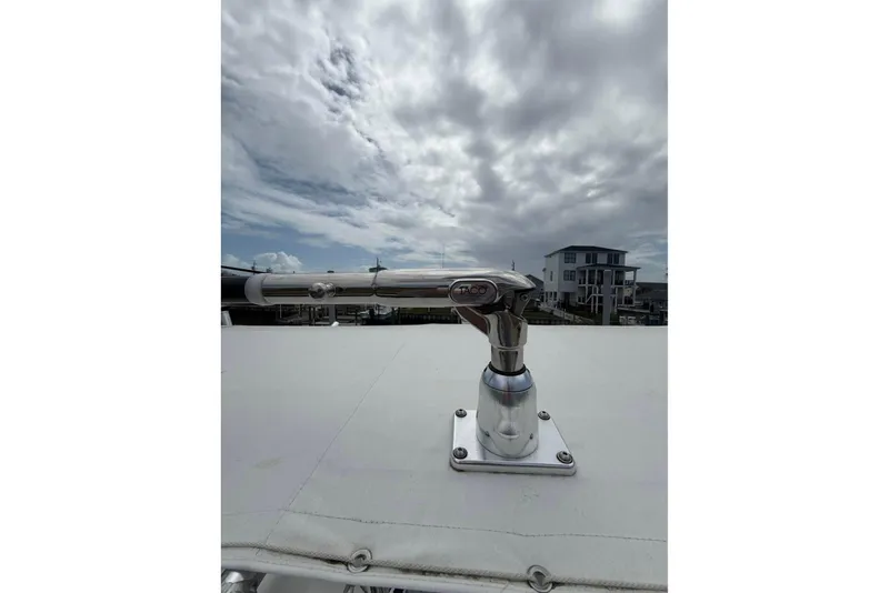 Slide: The Image of 2024 Contender 28 Tournament boat with TACO marine hardware under cloudy sky. - 7