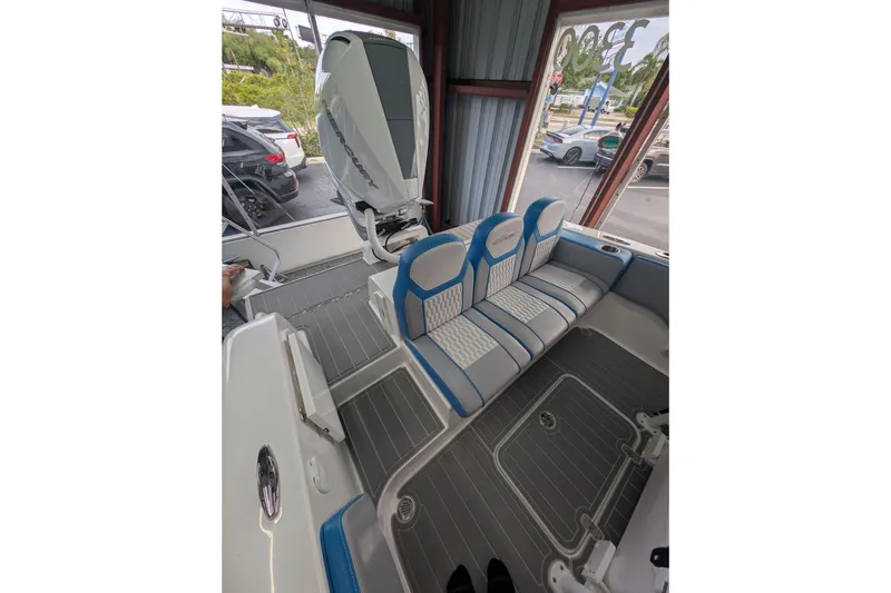Slide: The Image of 2024 Concept 27' CC boat interior with blue and white seating and modern design. - 6