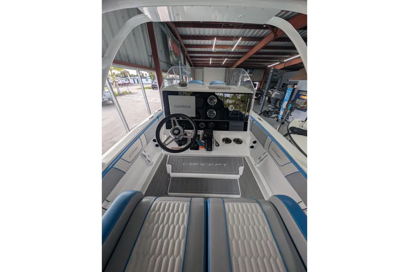 Slide: The Image of 2024 Concept 27' CC boat interior with modern dashboard and steering wheel. - 8