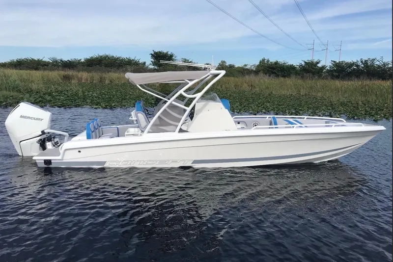 Slide: The Image of 2024 Concept 27' CC boat with Mercury engine on calm water. - 9