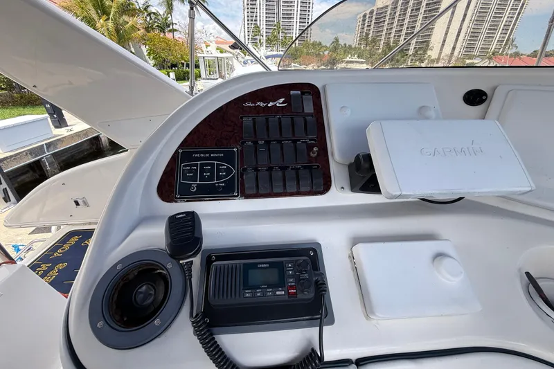 Slide: The Image of 2001 Sea Ray 450 Express Bridge helm with Garmin navigation and control panel. - 10