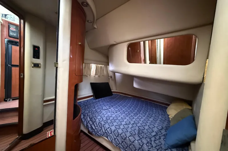 Slide: The Image of Cozy cabin interior of 2001 Sea Ray 450 Express Bridge yacht. - 17