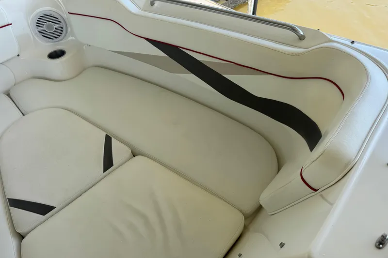 Slide: The Image of 2006 Rinker 282 Captiva Bowrider interior with white cushioned seating and speaker. - 15