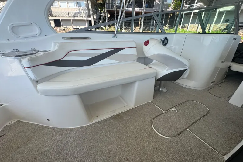 Slide: The Image of 2006 Rinker 282 Captiva Bowrider interior with white seating and modern design. - 17