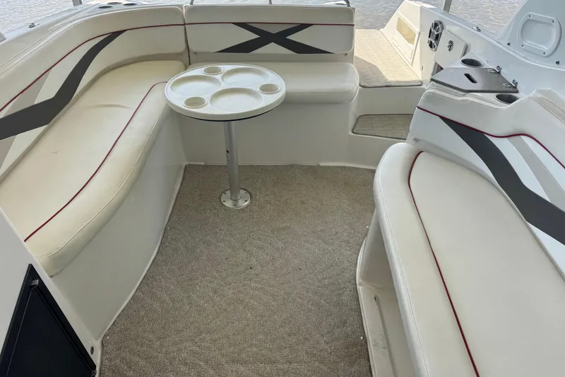 Slide: The Image of 2006 Rinker 282 Captiva Bowrider interior with seating and table. - 18