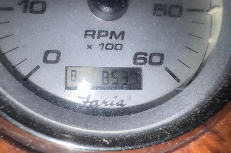 Slide: The Image of Close-up of a Faria tachometer displaying 831 RPM on a 2006 Rinker 282 Captiva Bowrider. - 24