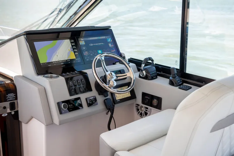 Slide: The Image of Helm of 2026 Regal 36 XO yacht with advanced navigation systems and controls. - 22