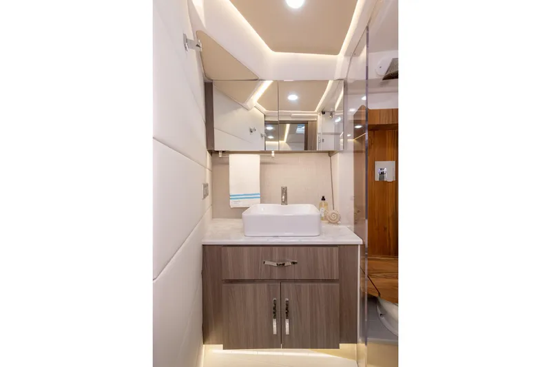 Slide: The Image of Luxurious bathroom interior of 2026 Regal 36 XO yacht with modern fixtures and elegant design. - 26