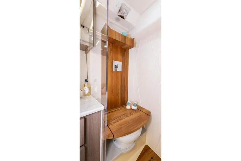 Slide: The Image of Luxurious bathroom in 2026 Regal 36 XO yacht with wooden accents and modern fixtures. - 27