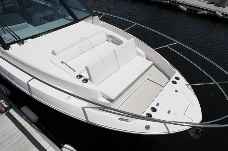 Slide: The Image of 2026 Regal 36 XO yacht with sleek white deck and seating area. - 28