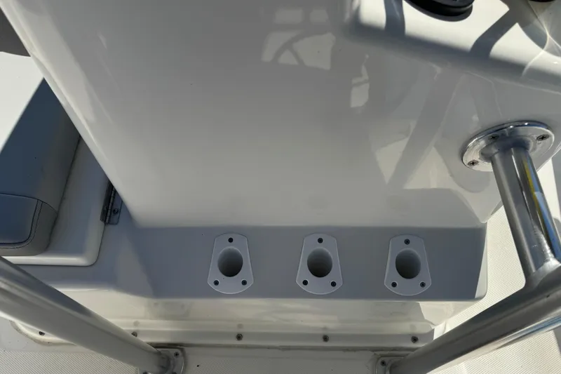Slide: The Image of 2024 May-Craft 1900CC boat console with rod holders and stainless steel railing. - 11