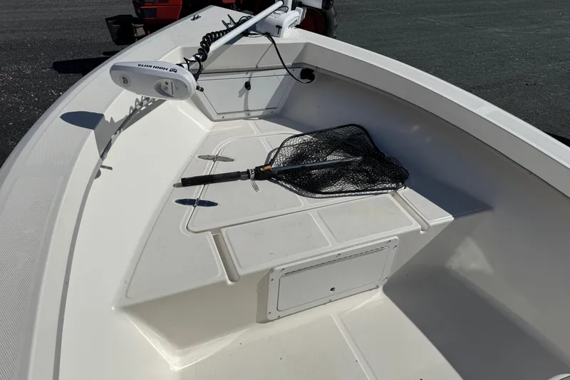 Slide: The Image of 2024 May-Craft 1900CC boat deck with fishing net and trolling motor. - 12