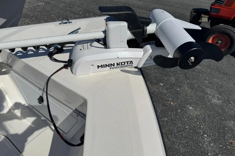 Slide: The Image of 2024 May-Craft 1900CC boat with Minn Kota PowerDrive trolling motor on deck. - 13