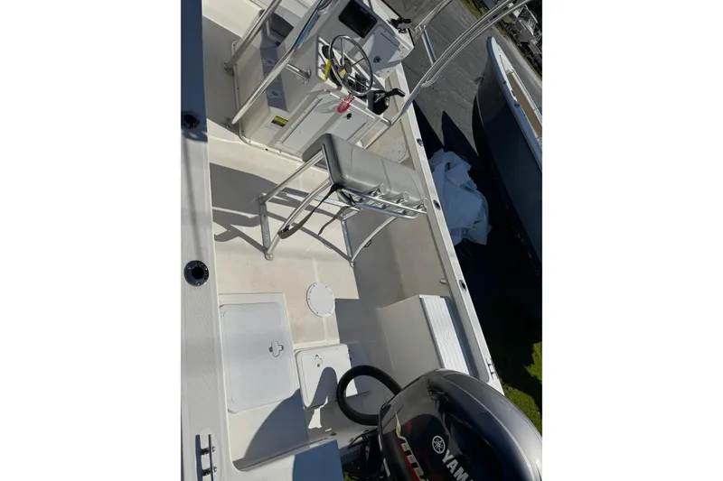 Slide: The Image of 2024 May-Craft 1900CC boat interior with Yamaha engine and steering console. - 5