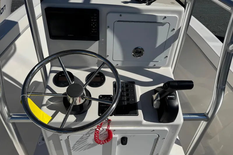 Slide: The Image of 2024 May-Craft 1900CC boat console with steering wheel and Yamaha controls. - 6
