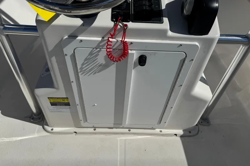 Slide: The Image of 2024 May-Craft 1900CC boat console with steering wheel and control panel. - 7