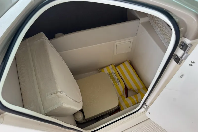 Slide: The Image of 2002 Maxum 2300 Premiere Edition cabin interior with cushions and life jackets. - 14