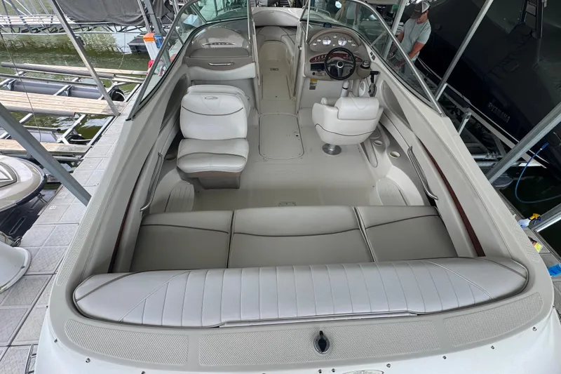 Slide: The Image of 2002 Maxum 2300 Premiere Edition boat interior with seating and steering wheel. - 5