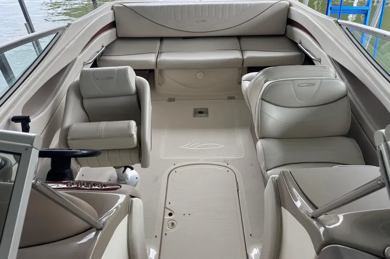 Slide: The Image of Interior of 2002 Maxum 2300 Premiere Edition boat with beige seating and steering wheel. - 6