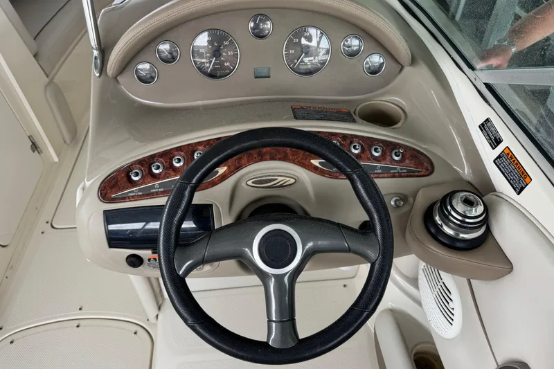 Slide: The Image of Steering console of a 2002 Maxum 2300 Premiere Edition boat with gauges and controls. - 7