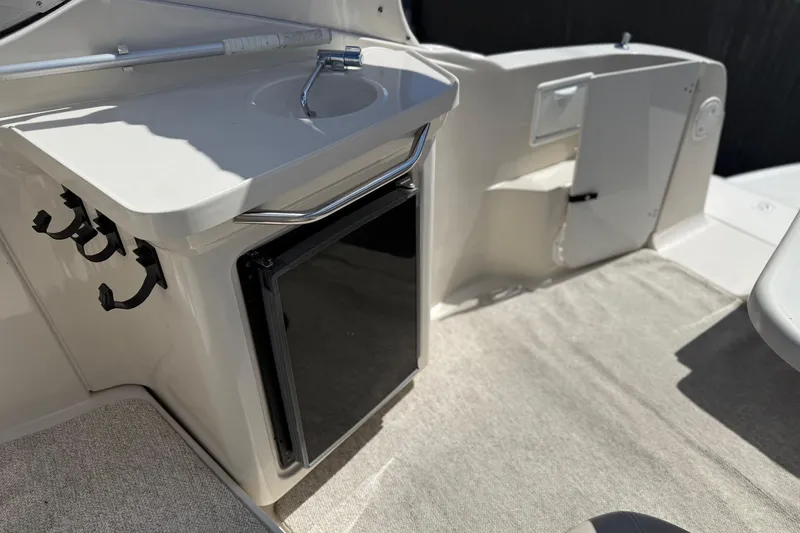 Slide: The Image of Interior of 2000 Regal Commodore 2960 boat with sink and storage area. - 14