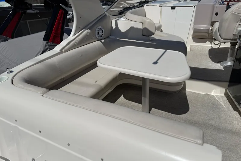 Slide: The Image of Interior of a 2000 Regal Commodore 2960 boat with seating and table. - 7