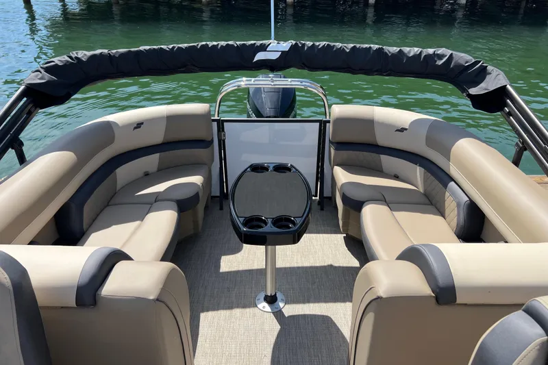 Slide: The Image of Luxurious seating on 2026 Starcraft EXS 3 R DH boat, docked by the water. - 11